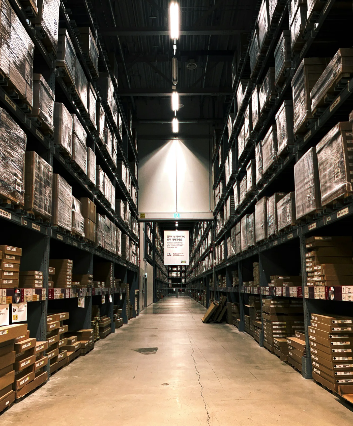 Warehouse racks with packaged inventory; illustrative stock photograph